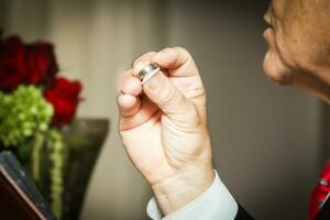 Officient holding wedding rings photo