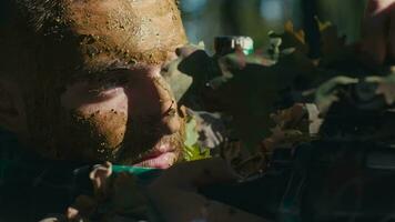 A Masked Soldier Takes Aim Through a Sniper Scope video