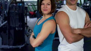 Fit couple shows thumbs up at the gym video