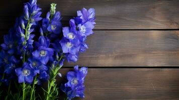 Delphinium Flower on Wood Background with Copy Space, AI Generative photo