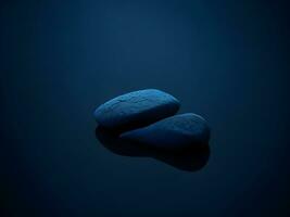 A few pebbles on the surface of gently rippling blue water ai generate photo