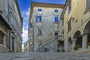 Picture from the town of Groznjan with idyllic cobbled streets and buildings made of natural stone photo