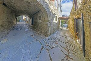 Picture from the town of Groznjan with idyllic cobbled streets and buildings made of natural stone photo