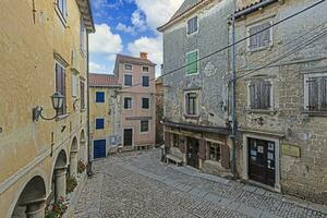 Picture from the town of Groznjan with idyllic cobbled streets and buildings made of natural stone photo