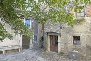 Picture from the town of Groznjan with idyllic cobbled streets and buildings made of natural stone photo