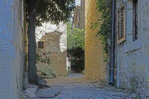 Picture from the town of Groznjan with idyllic cobbled streets and buildings made of natural stone photo