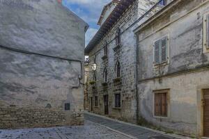 Picture from the town of Groznjan with idyllic cobbled streets and buildings made of natural stone photo