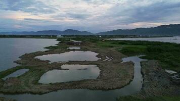 aerial view of limboto lake, Gorontalo- Indonesia. New Road Along Lake's Edge Takes Shape video