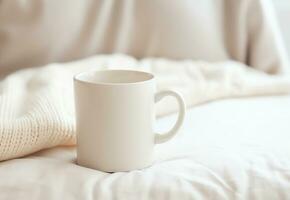 Blank empty white coffee mug mockup on warm knitted clothes in autumn and winter season,AI Generated photo