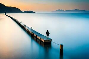 un hombre en pie en un muelle mirando fuera terminado el océano. generado por ai foto