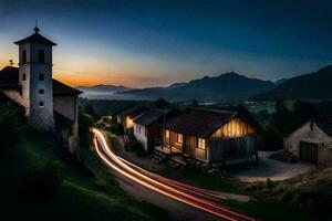 un pueblo a puesta de sol con ligero caminos. generado por ai foto