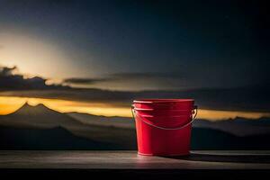 a red bucket on a table with mountains in the background. AI-Generated photo