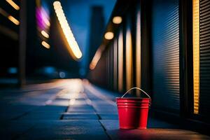 a red bucket sits on the sidewalk in front of a building. AI-Generated photo