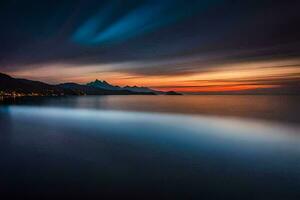 un largo exposición fotografía de el puesta de sol terminado el océano. generado por ai foto