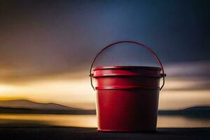 a red bucket sitting on the ground near the water. AI-Generated photo