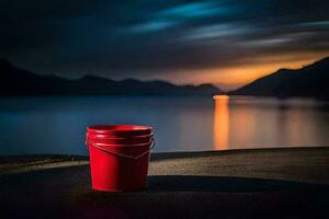 a red bucket sits on the beach at sunset. AI-Generated photo