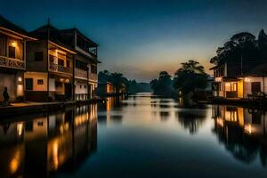 un canal en el medio de un pueblo a noche. generado por ai foto