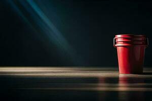 a red bucket sitting on a wooden floor. AI-Generated photo