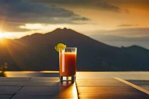 a glass of orange juice on a table in front of a mountain. AI-Generated photo