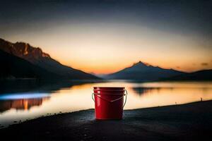 a red bucket sits on the shore of a lake at sunset. AI-Generated photo