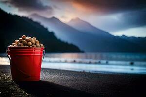 a bucket of nuts on the beach with mountains in the background. AI-Generated photo