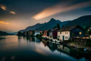 un lago y casas en el montañas a puesta de sol. generado por ai foto