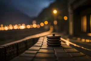 a stack of stones sitting on a brick walkway at night. AI-Generated photo