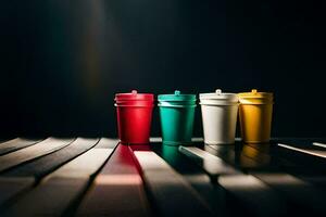 four colorful cups sit on a table. AI-Generated photo