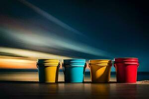 three colorful buckets sit on a table in front of the ocean. AI-Generated photo