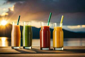 four different juices are sitting on a table with the sun setting behind them. AI-Generated photo