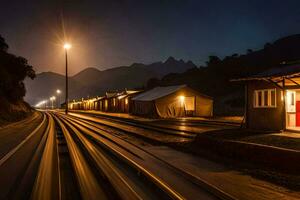 a train tracks at night with a red door and a light. AI-Generated photo