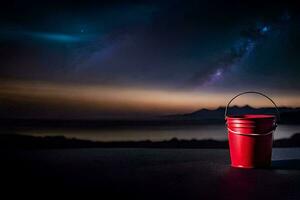 a red bucket sitting on a table with a night sky in the background. AI-Generated photo