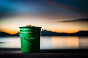 a green bucket sitting on the ground near the water. AI-Generated photo