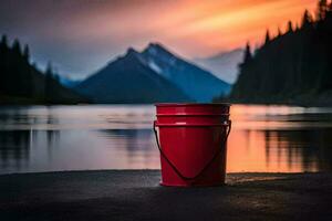 a red bucket sits on the shore of a lake at sunset. AI-Generated photo