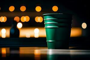 a green cup sitting on a table in front of a lit window. AI-Generated photo