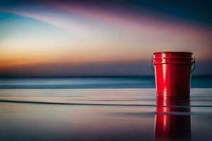 a red bucket sitting on the beach at sunset. AI-Generated photo