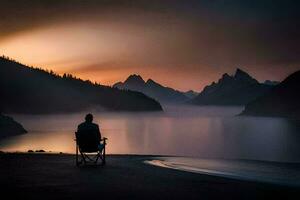 un hombre se sienta en un silla con vista a un lago y montañas. generado por ai foto