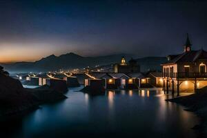 un lago a noche con casas y un montaña en el antecedentes. generado por ai foto