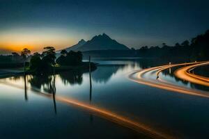 un largo exposición fotografía de un río y montaña a puesta de sol. generado por ai foto