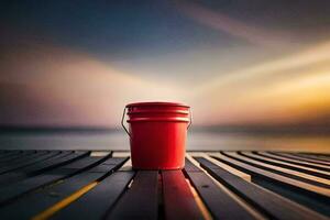 a red bucket sitting on a wooden dock at sunset. AI-Generated photo