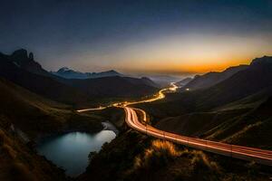 un la carretera devanado mediante el montañas a puesta de sol. generado por ai foto