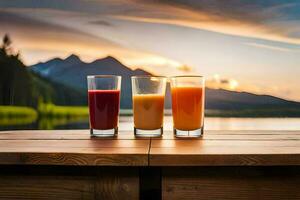 three glasses of juice on a table in front of a lake. AI-Generated photo