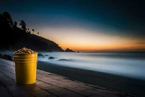 a bucket of peanuts on the beach at sunset. AI-Generated photo