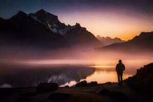 a man stands on the shore of a lake at sunset. AI-Generated photo