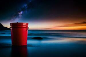 a red bucket sitting on the beach at night. AI-Generated photo