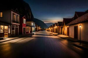 a street at night with houses and a mountain in the background. AI-Generated photo