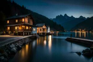 un lago a noche con casas en el costa. generado por ai foto