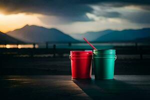 two red and green buckets sitting on a table with mountains in the background. AI-Generated photo