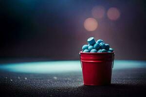 un rojo Cubeta lleno con azul pastillas generado por ai foto