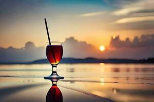 un vaso de rojo vino en el playa a puesta de sol. generado por ai foto